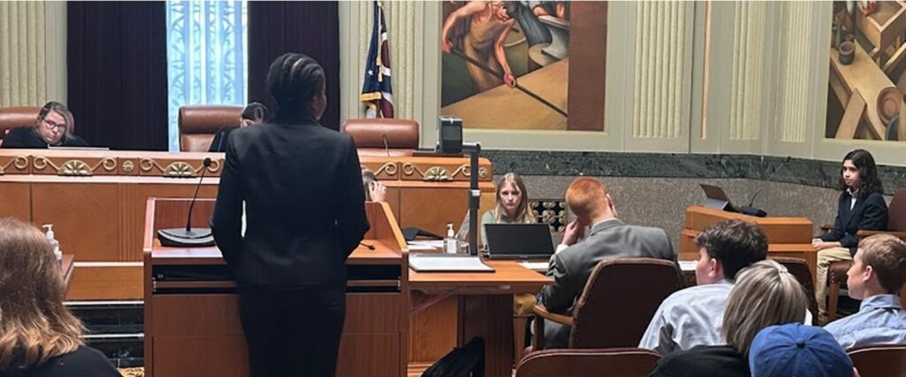 menlo students participating in a mock trial case in a courtroom